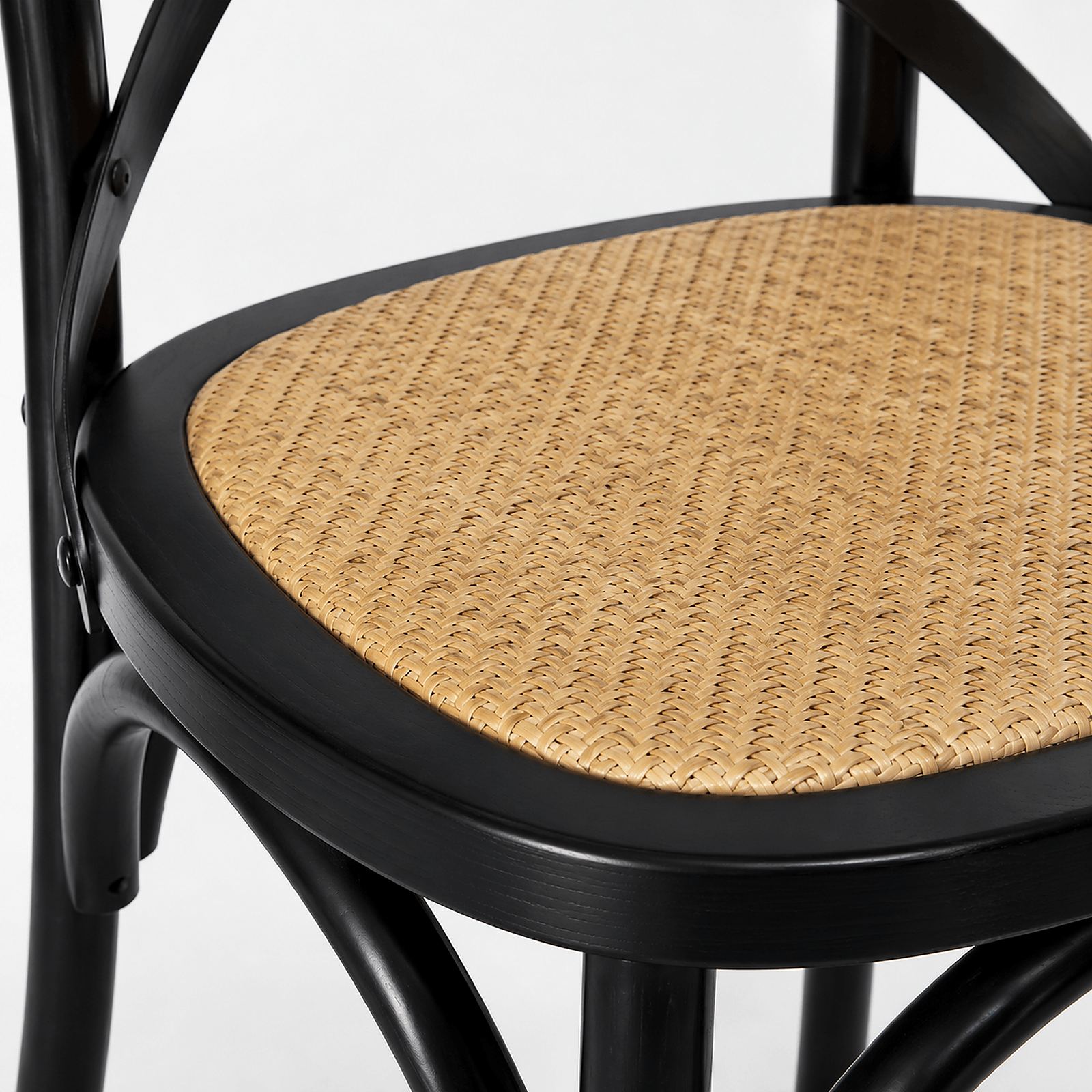 Woven-style seat detail on black cross-back cafe chair